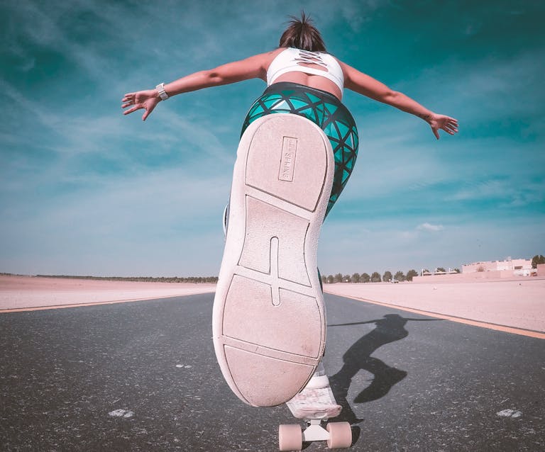 A skateboarder enjoying sunny skateboarding in Dubai, showcasing vibrant motion.